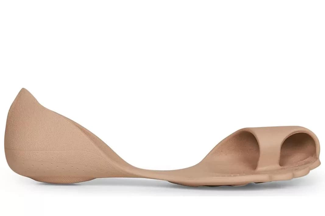 Balenciaga Zero Sneakers - A minimalist nude-colored barefoot shoe with a sculpted anatomical shape, open toe design, and ultra-thin sole, resembling a molded second skin for the foot.