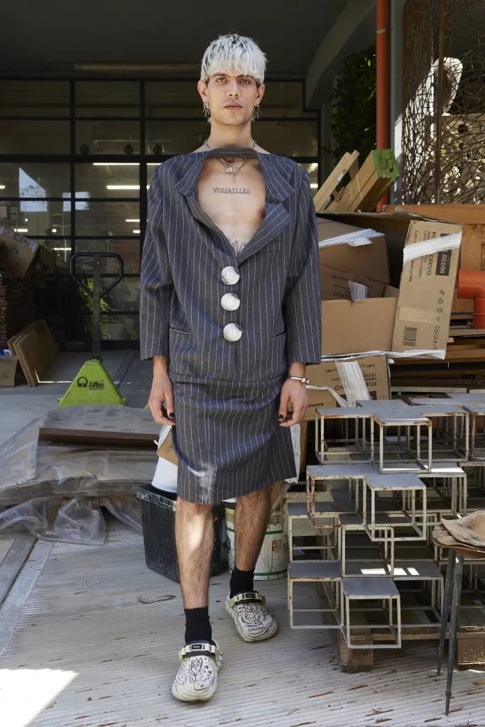 Model on the Simon Cracker SS26 runway wearing a deconstructed blazer